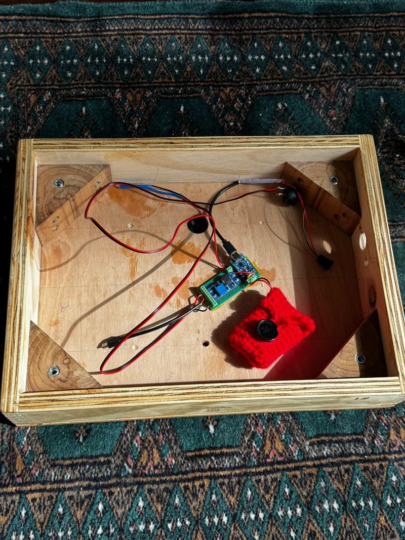 Inside of a box with speaker and control board
